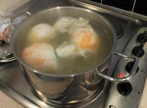 The orange and lemon dumplings, boiling in their muslin wrappers