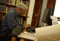 Volunteer Jim Garrod researching political cartoons for one of our projects