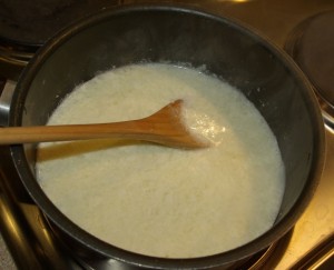 Curdling milk to make lemon caudle. We turned the milk with lemon juice.